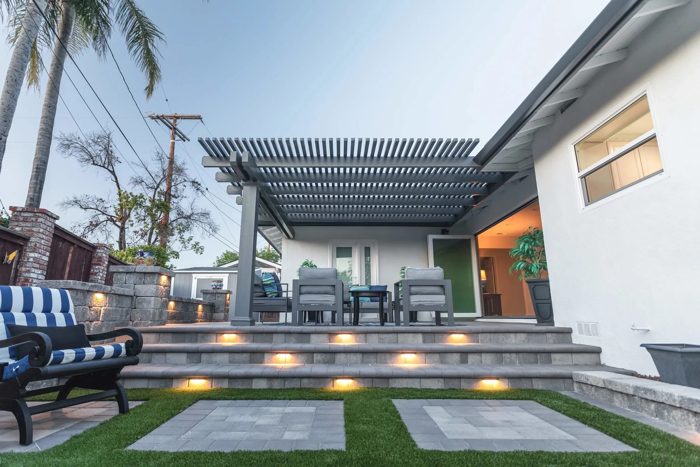 Custom outdoor patio with seating and landscaping